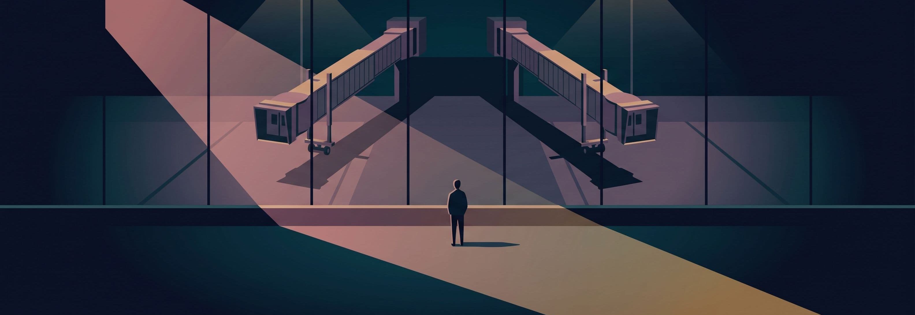 Two identical jet bridges hang above the ground at night. Their shadows still touch the tarmac below.